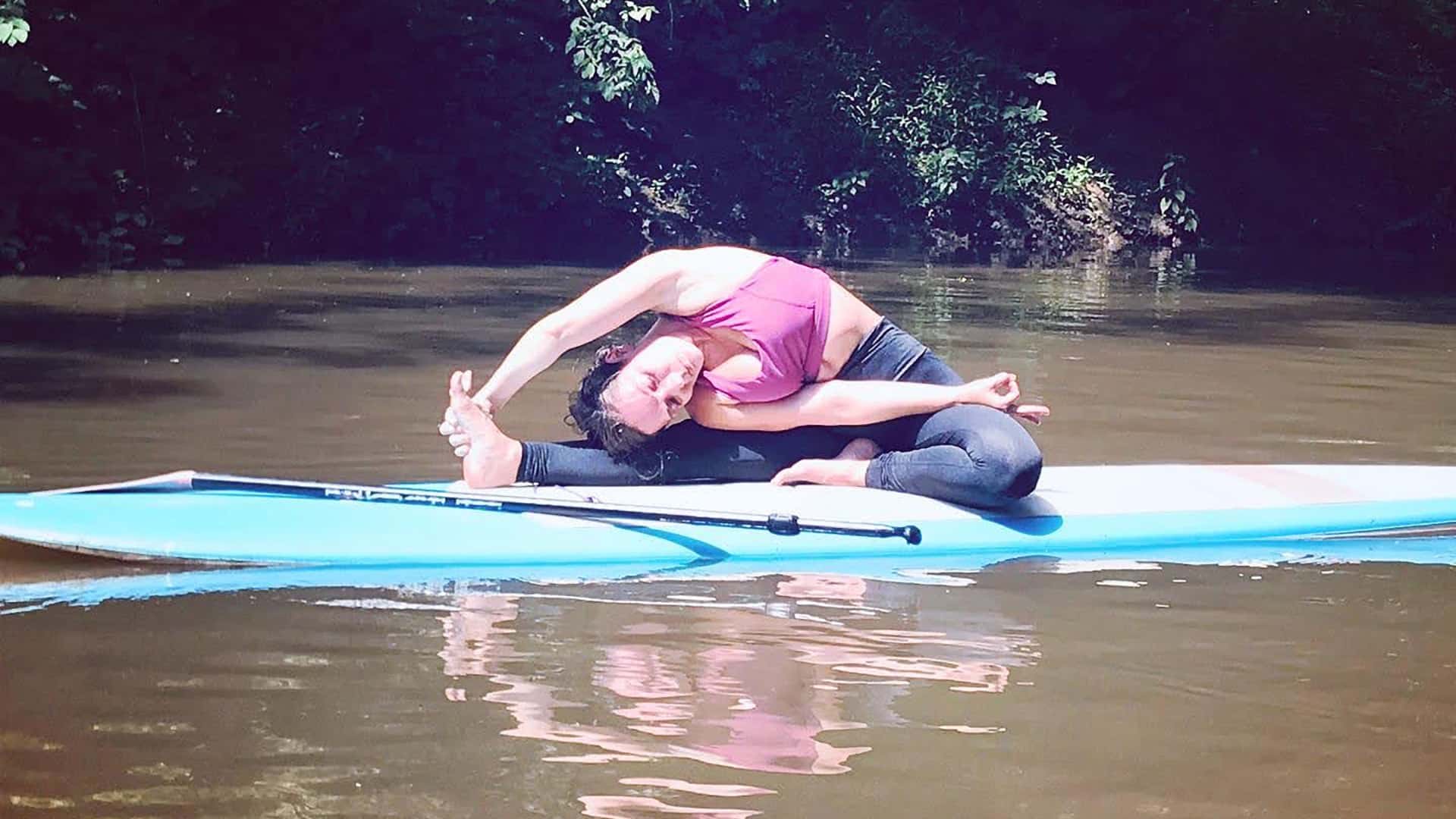 SUP yoga pose on French Broad River.