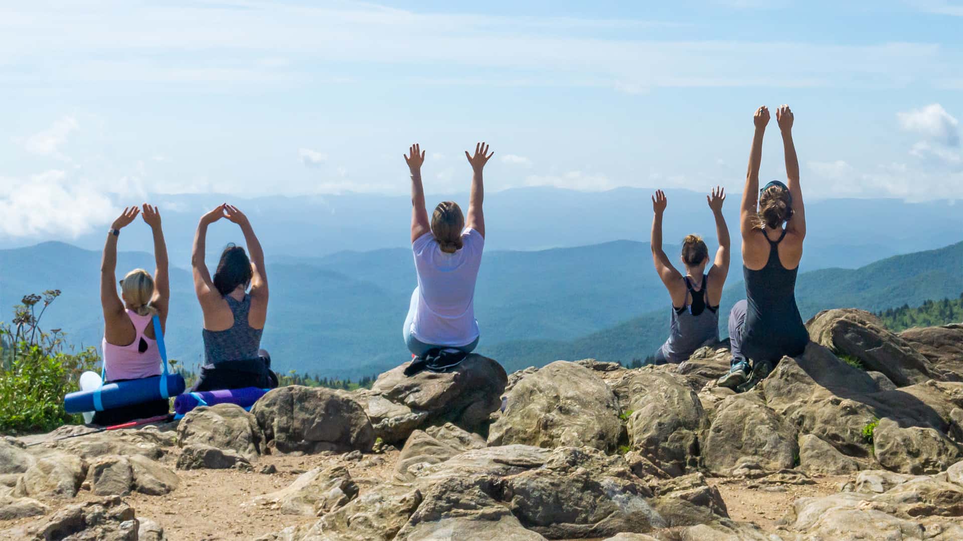 Yoga hike on rock outcrop in Gerton, NC.