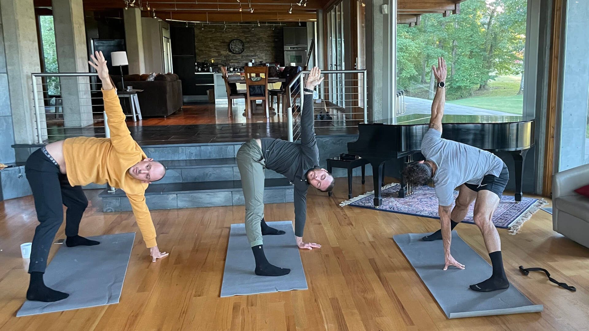 Private yoga session for men in Airbnb living room.
