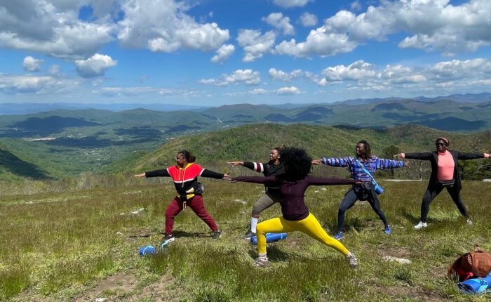 Women's group at private mountaintop yoga session in Blue Ridge Mountains.